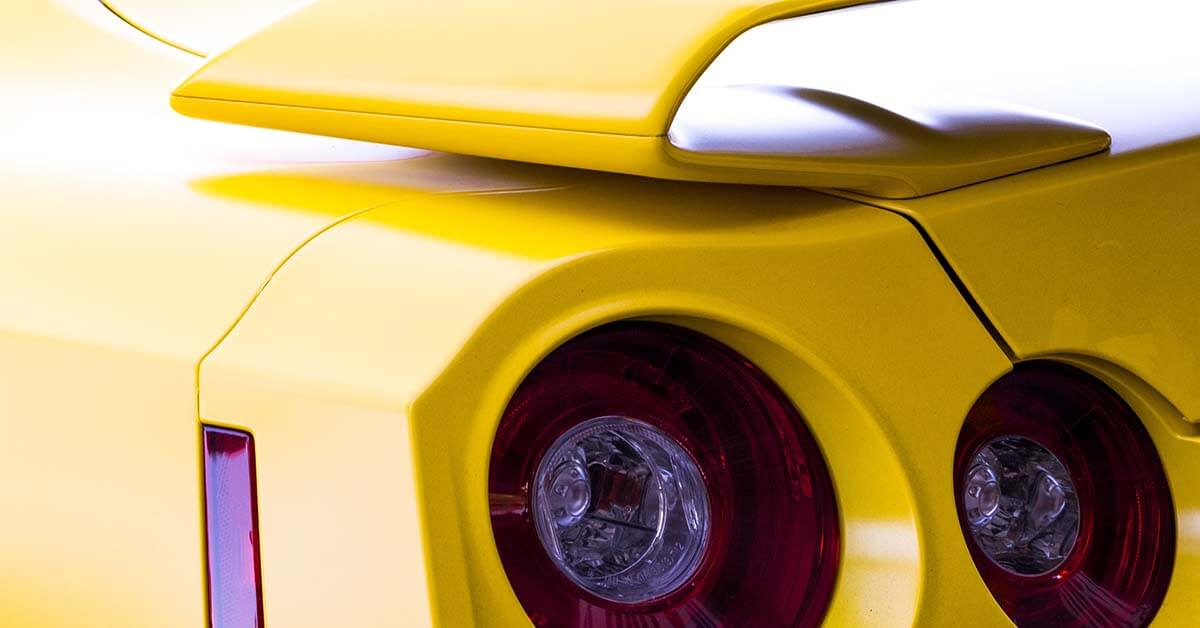 Headlines of a striking yellow sports car