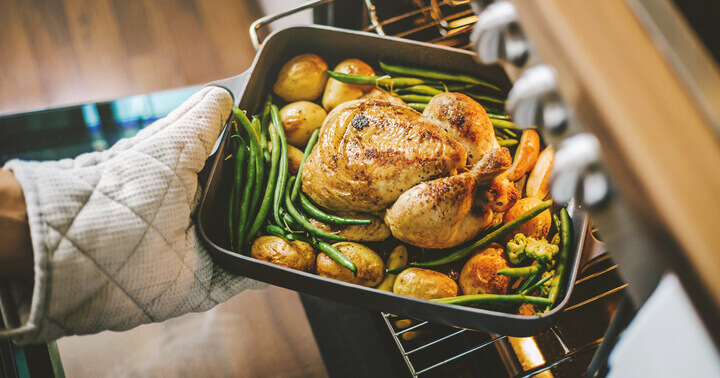 A roasted chicken being cooked to golden perfection