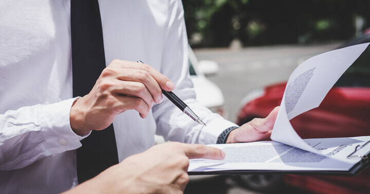 A consultant discussing car loan with a potential buyer