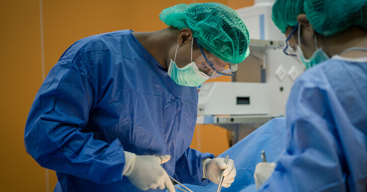 Doctors performing surgery on a patient who has been hospitalised after an unfortunate accident