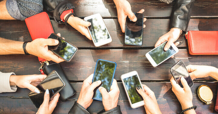 A group of friends with mobile phones 