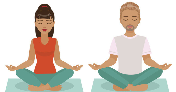 Couple in meditative sitting position looking calm