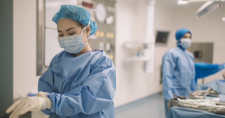 Two female surgeons preparing for a surgery
