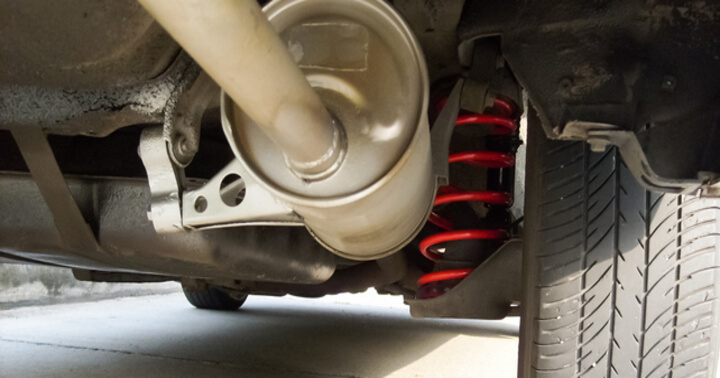 Spring suspension next to the wheel acting as a shock absorber