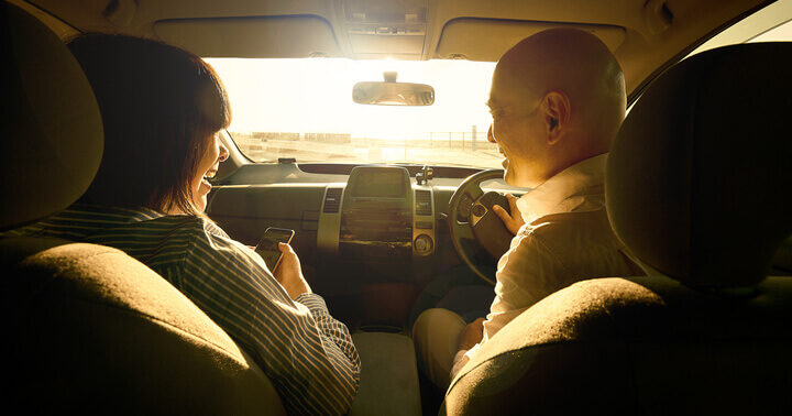 A happy couple in a car together