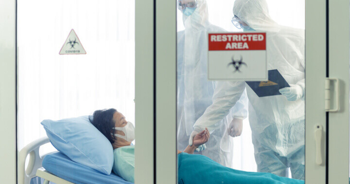 An old lady in the hospital Restricted Area section being quarantined during the coronavirus pandemic.