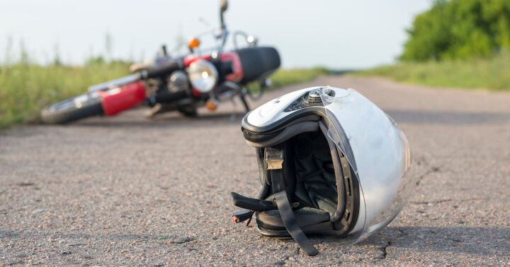 Motorcycle accident with fallen helmet and bike