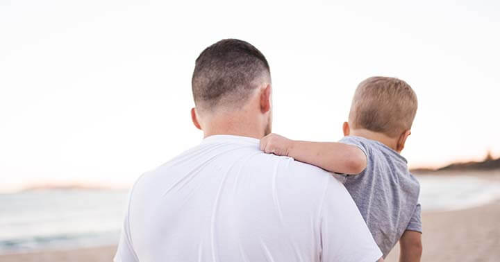 Father and son at beach