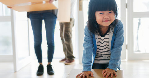 Toddler and parents in new home