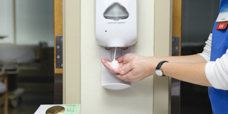 An individual using hand sanitiser as a way to prevent flu and viral infection as alternative to healthcare items