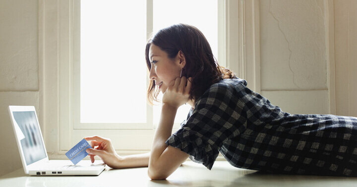 Lady doing an online purchase at home