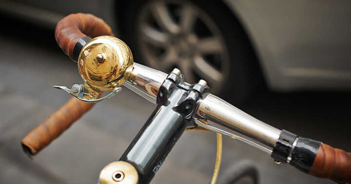 A gold bell on an e-scooter