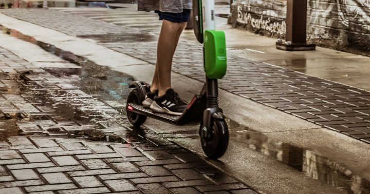 A rider on a e-scooter on the street