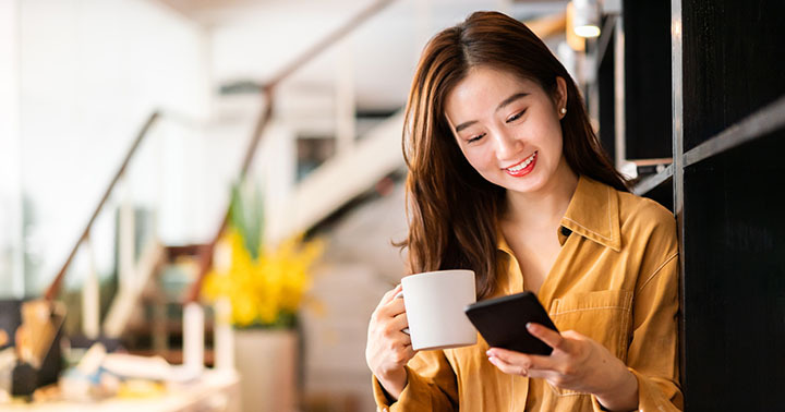 Young businesswoman using a smartphone in office