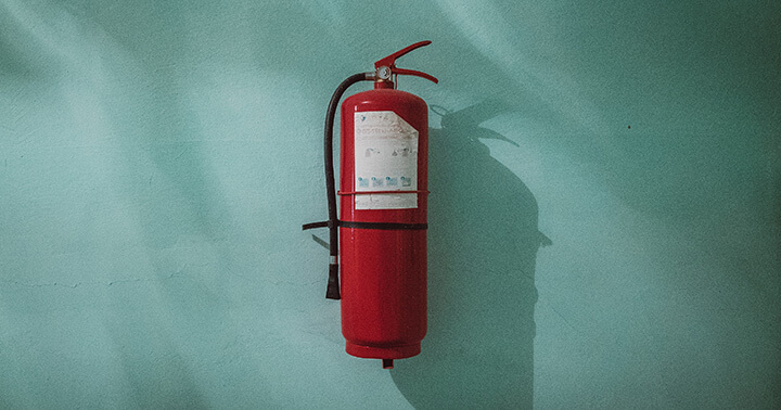 Image of fire extinguisher to symbolise emergency funds