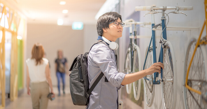 A young man looking at for his next bike