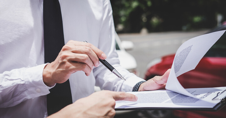 A person deregistering their car at a scrapyard