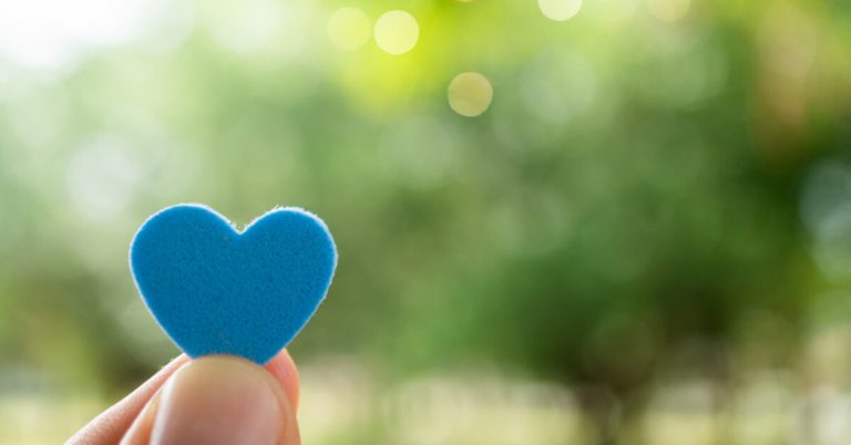 A blue heart signifying hope on a bright day for cancer patients