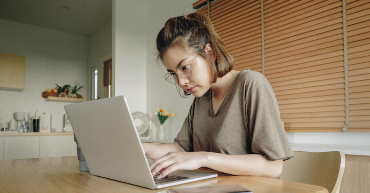 Image of a stressed lady working from home