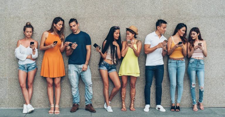 Young adults with mobile devices