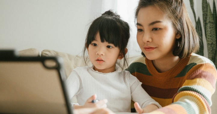 mother and daughter doing home-based learning