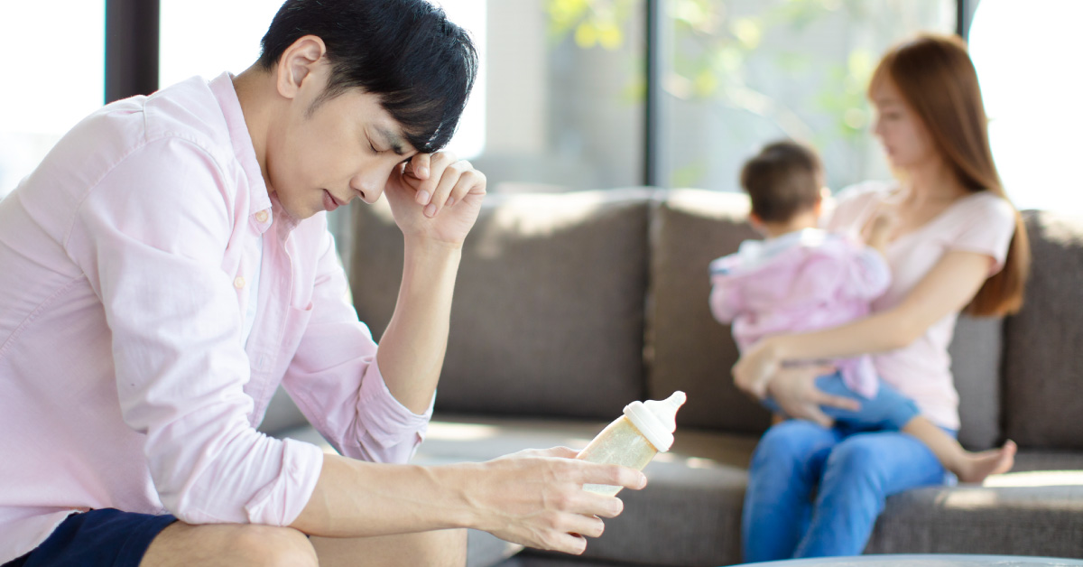 tired-father-and-mother-with-baby-at-home